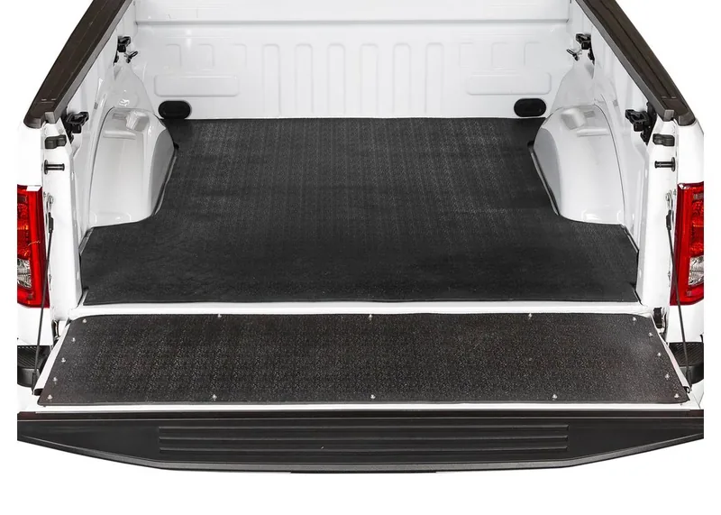 Rubber tailgate mat protecting the tailgate loading zone of a pickup truck